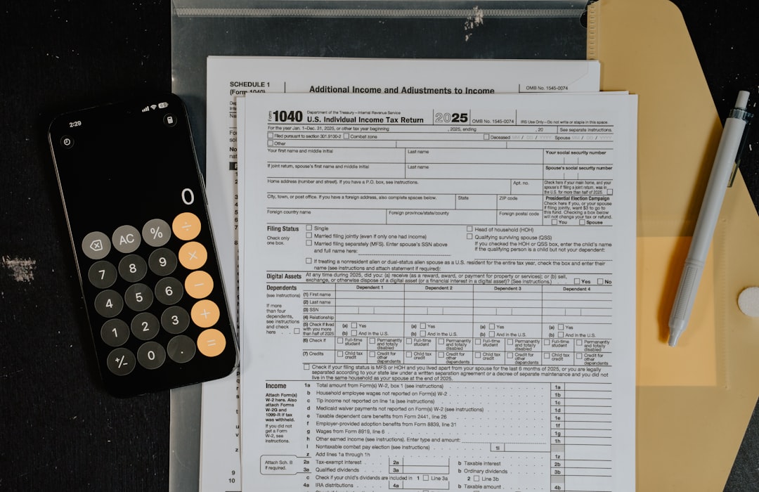 tax-forms-and-calculator-on-a-desk-qdwagalnco4